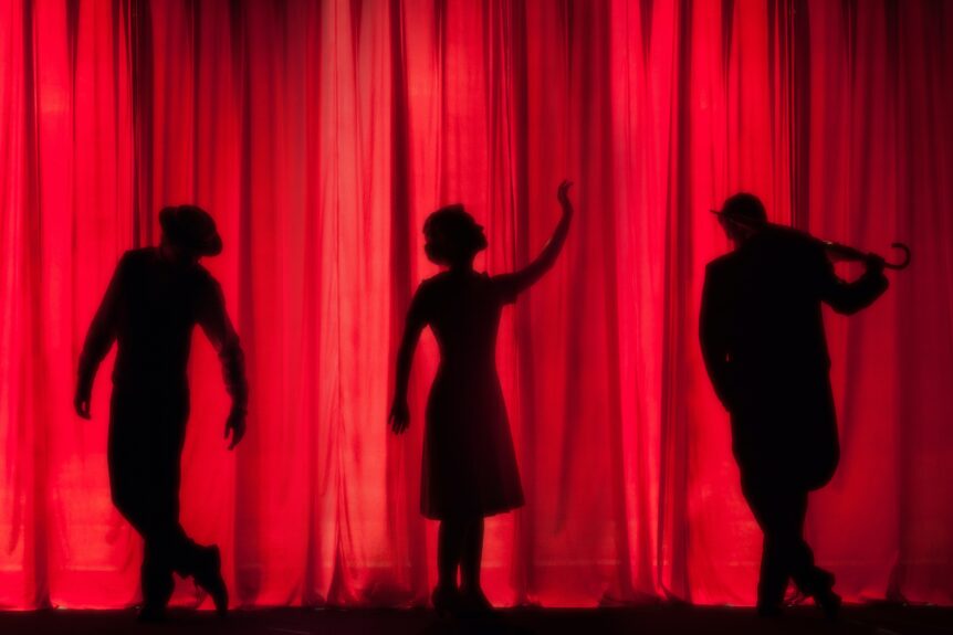 silhouettes on a red background
